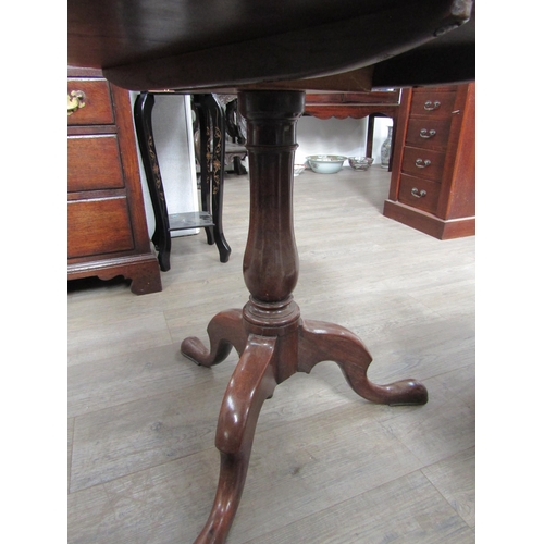 1252 - A George III mahogany tilt-top tripod table, on tripod form base, 71cm tall x 74cm diameter