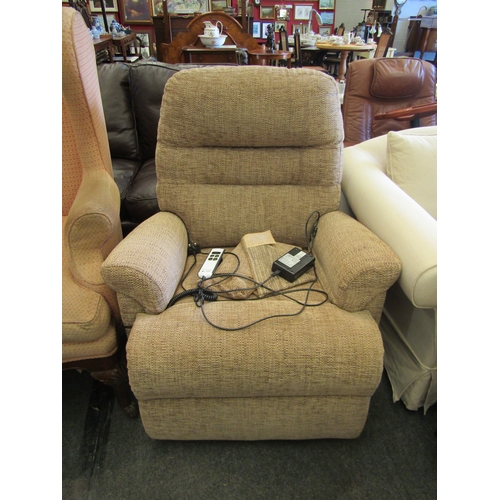 1293 - A Sherborne electric reclining armchair with paperwork and leads, etc