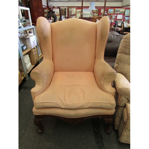 1294 - A 19th Century George II style walnut framed wingback armchair of large proportions