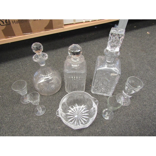 1342 - Eight pieces of miscellaneous glassware including three 20th Century and earlier decanters, a toast ... 