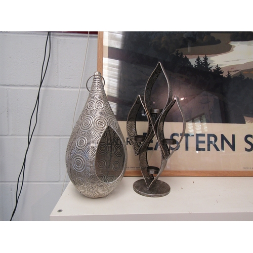 1446 - A pierced metal candle holder, 41cm tall, and another of teardrop form (2)