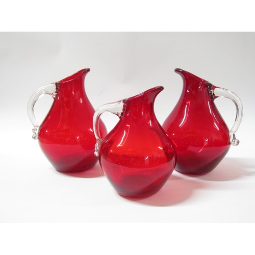 1527 - Three Whitefriars jugs in Ruby, two 9422 and a 9423.  Tallest 22cm