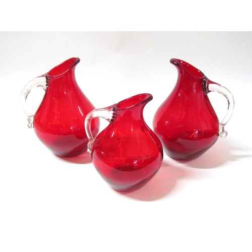 1527 - Three Whitefriars jugs in Ruby, two 9422 and a 9423.  Tallest 22cm