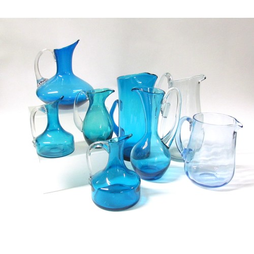 1539 - Eight various blue glass jugs including Whitefriars, plus Dartington tankard and similar carafe.  Ta... 