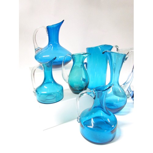 1539 - Eight various blue glass jugs including Whitefriars, plus Dartington tankard and similar carafe.  Ta... 