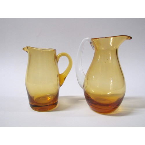 1546 - A collection of fifteen Amber glass jugs including Whitefriars, Krosno, etc.  Tallest 28cm