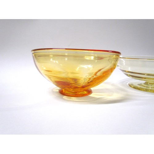 1554 - A pale amber glass pedestal bowl, 25cm diameter x 9.5cm high, together with a darker bowl with wave ... 