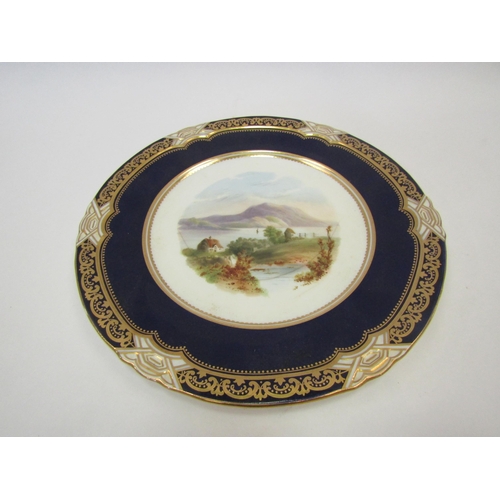 1433 - A Coalport cabinet plate hand-painted with lakeland scene, cobalt blue and gilt border, 24cm diamete... 