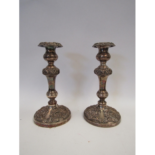 1454 - A pair of ornate plated candlesticks, 22cm tall