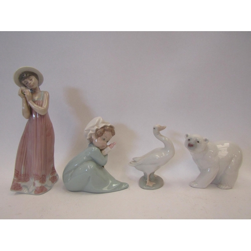 1506 - Four Lladro figures, Polar Bear, baby with bottle, girl holding flower and Goose