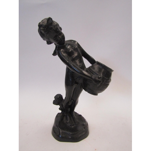 1509 - A bronzed figure of girl carrying a basket, 24cm tall