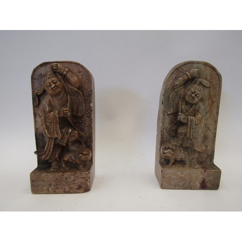 1510 - A pair of hardstone book-ends carved in high relief depicting figures and Dogs of Fo (one restored) ... 