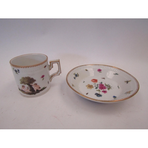 1513 - A 19th Century hard paste porcelain cabinet coffee can and saucer, hand-painted with putti under tre... 