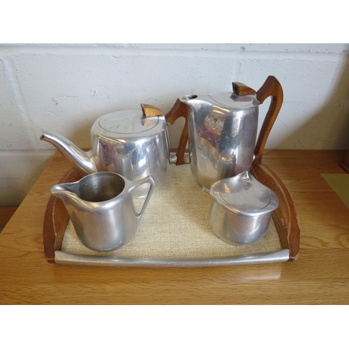 1122 - A Picquot ware tea set and tray