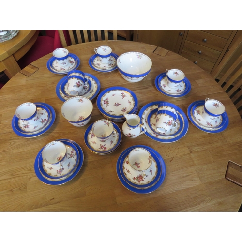 1130 - A twelve place setting tea set consisting of twelve cups and saucers, twelve tea plates, two bread a... 