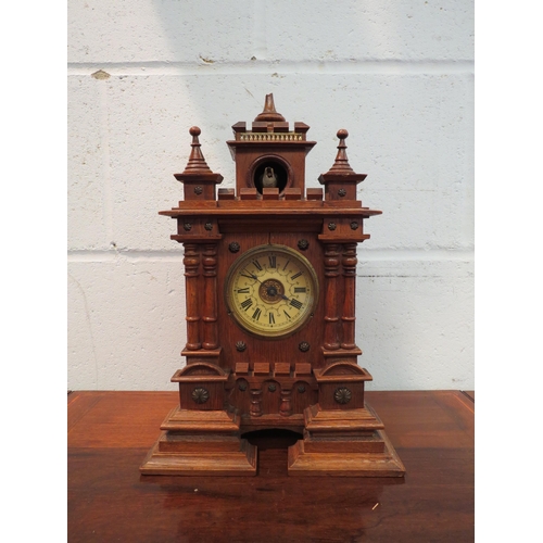 1139 - An unusual Victorian oak turret cuckoo mantel clock (finial a/f)