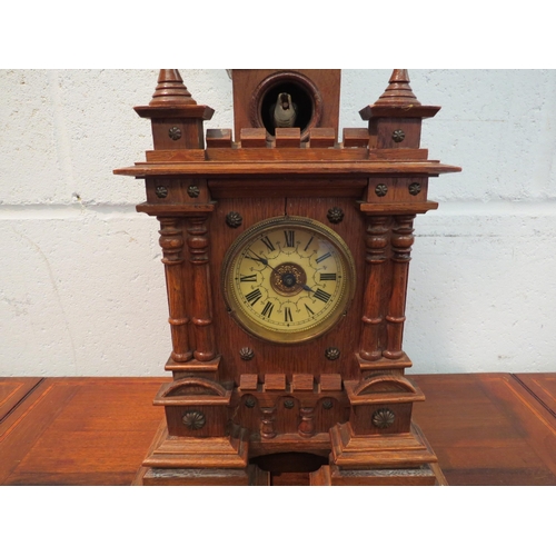 1139 - An unusual Victorian oak turret cuckoo mantel clock (finial a/f)