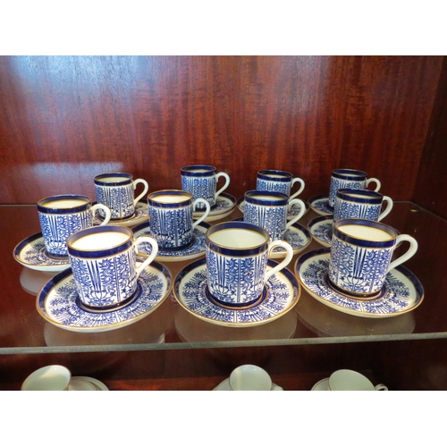 1178 - A Coalport coffee set printed blue on white ground pattern, gilt rims, 12 saucers, 11 cans (some pie... 