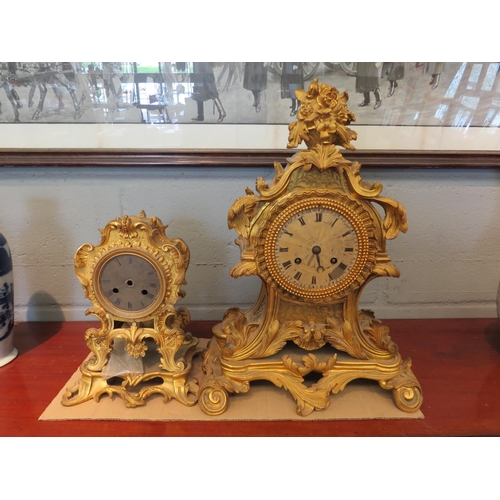 1186 - A 19th Century French gilded mantel clock, 37cm, and a similar case, 32cm, (minus hands and pendulum... 