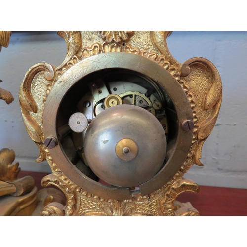 1186 - A 19th Century French gilded mantel clock, 37cm, and a similar case, 32cm, (minus hands and pendulum... 