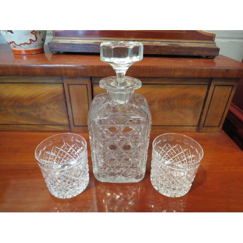 1192 - A hobnail cut whisky decanter (large chips to stopper) and two cut glass whisky tumblers