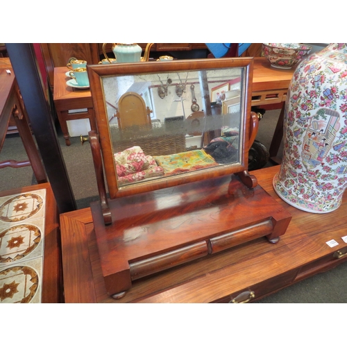 1221 - A Victorian flame mahogany dressing table mirror with two cushion drawers and scrolled supports, wea... 