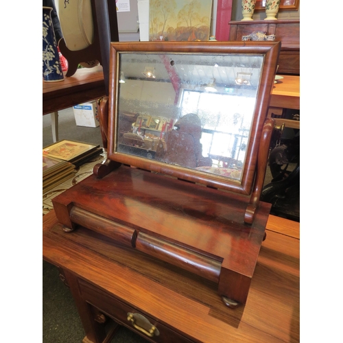 1221 - A Victorian flame mahogany dressing table mirror with two cushion drawers and scrolled supports, wea... 