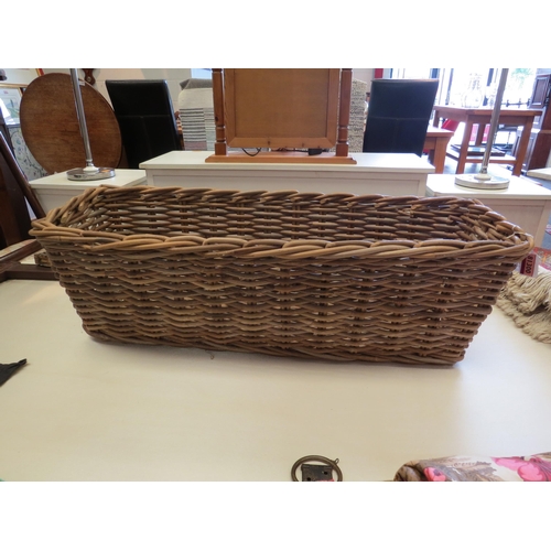 1228 - A rectangular wicker basket, 85cm x 30cm