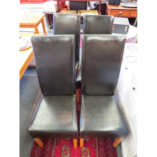 1251 - A set of four modern leather dining chairs