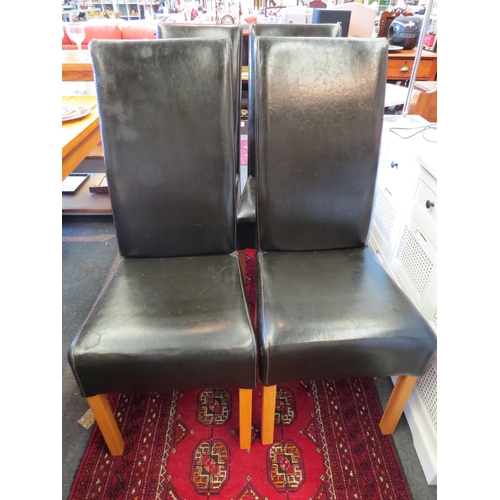 1251 - A set of four modern leather dining chairs