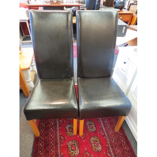 1251 - A set of four modern leather dining chairs