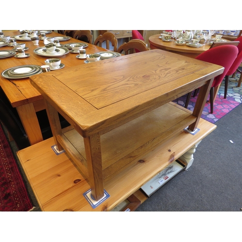 1261 - An oak two tier occasional table, 45cm tall x 90cm long x 50cm wide