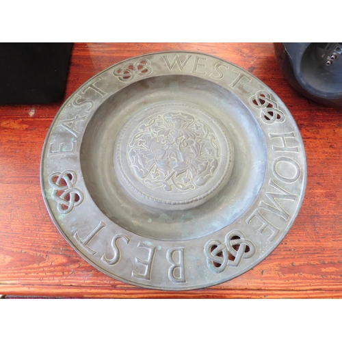 1268 - A large copper dish 'East West Home Best', 52.5cm diameter