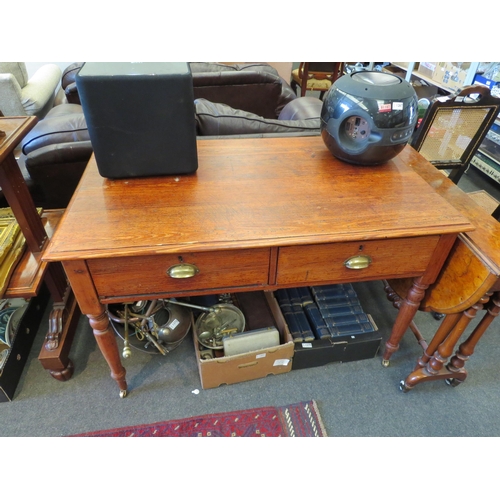 1269 - A Victorian pine two drawer school desk/table on turned legs and brass castors, 78cm tall x 122cm wi... 