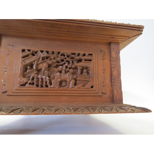 1328 - A Victorian carved Oriental jewellery box, velvet lined interior, one foot missing