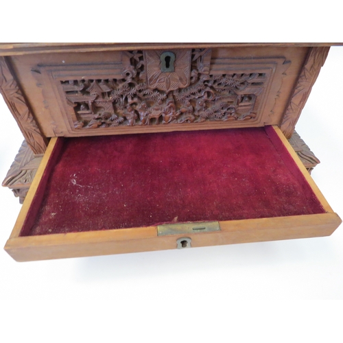 1328 - A Victorian carved Oriental jewellery box, velvet lined interior, one foot missing