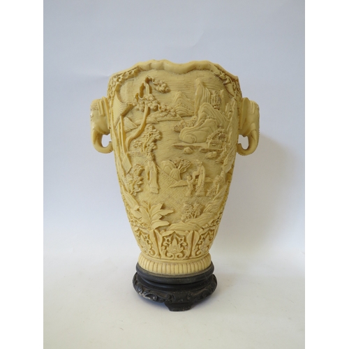 1335 - A resin vase, heavily embossed with Oriental figures in landscape, elephant handles, 31cm tall