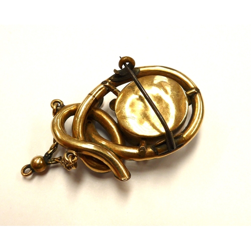 6403 - A Victorian gold memoriam pendant/brooch with black enamel decoration, hair panel decoration to fron... 