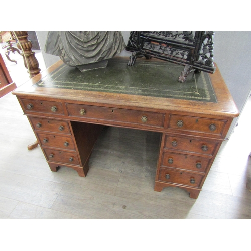 2083 - A late Victorian oak nine drawer twin pedestal desk, leather inset top, 73cm x 120cm x 72cm