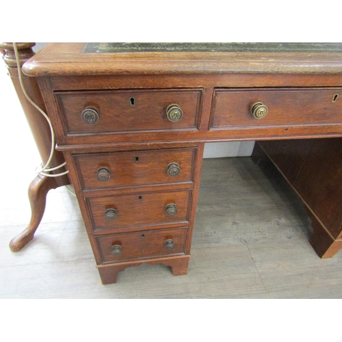 2083 - A late Victorian oak nine drawer twin pedestal desk, leather inset top, 73cm x 120cm x 72cm