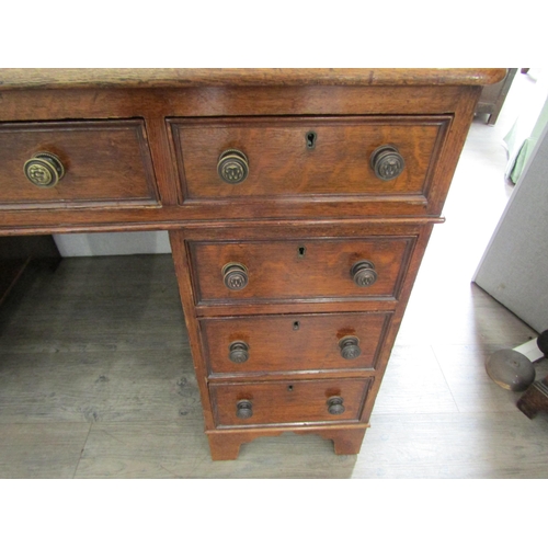 2083 - A late Victorian oak nine drawer twin pedestal desk, leather inset top, 73cm x 120cm x 72cm