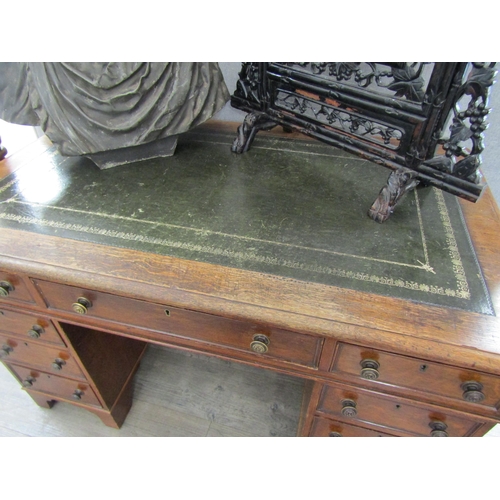 2083 - A late Victorian oak nine drawer twin pedestal desk, leather inset top, 73cm x 120cm x 72cm