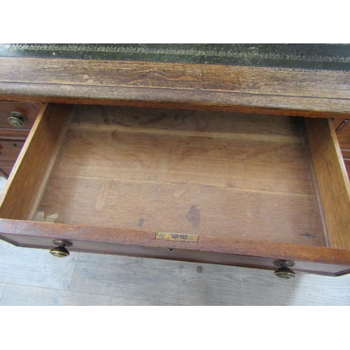 2083 - A late Victorian oak nine drawer twin pedestal desk, leather inset top, 73cm x 120cm x 72cm