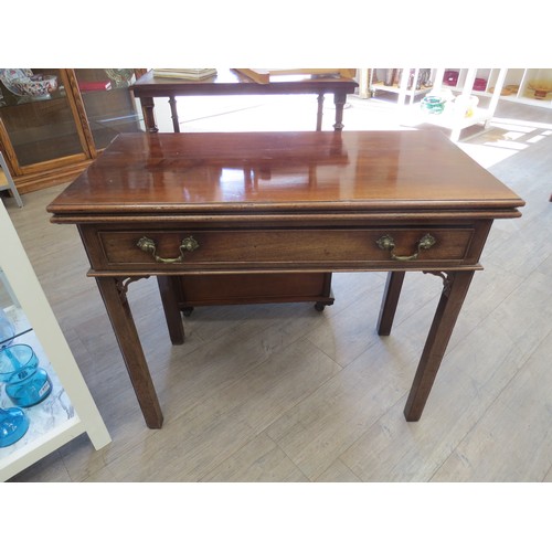 2148 - A Georgian mahogany fold top tea table with pierced fret work spandrels, back spandrel slighly damag... 