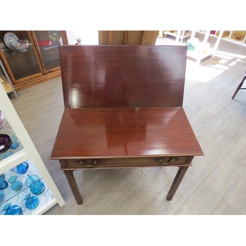 2148 - A Georgian mahogany fold top tea table with pierced fret work spandrels, back spandrel slighly damag... 