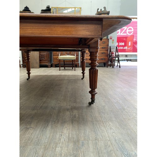 2151 - A 19th Century mahogany dining table, pull out mechanism with two extra leaves, 73cm x 258cm x 135cm