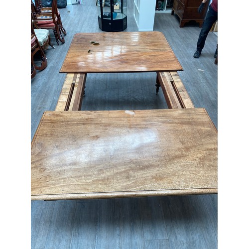 2151 - A 19th Century mahogany dining table, pull out mechanism with two extra leaves, 73cm x 258cm x 135cm