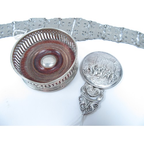 6338 - A tray of miscellaneous silver and white metal to include a continental white metal mirror embossed ... 