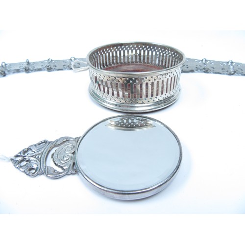 6338 - A tray of miscellaneous silver and white metal to include a continental white metal mirror embossed ... 