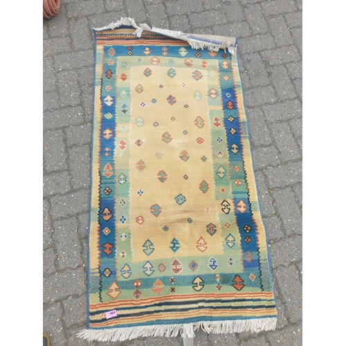 2299 - A small yellow and blue rug